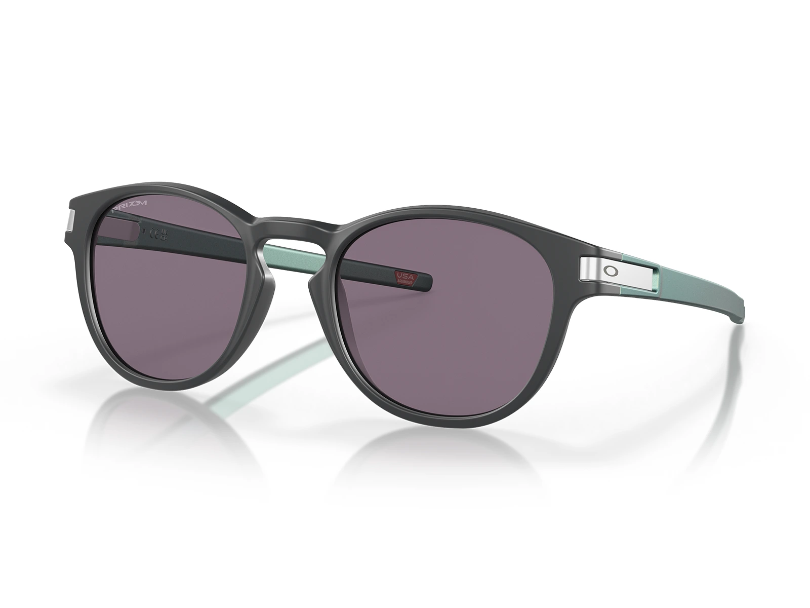 Gafas de sol Oakley Latch OO9265-62 Marco gris, varillas verdes y lentes Prizm gris